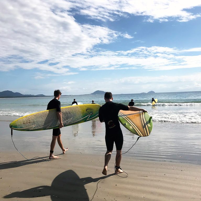 Remote workers take morning surfing lessons in Florianopolis, Brazil