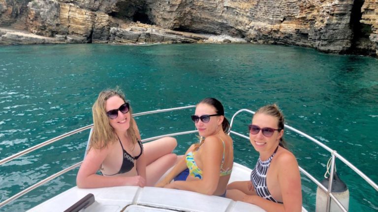 Remote workers on a boat in Italy as Hacker Paradise alumni