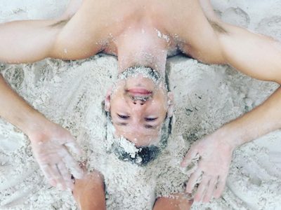 Hacker Paradise CEO playing in the sand on the beaches of Cambodia