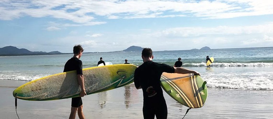 Remote workers take morning surfing lessons in Florianopolis, Brazil