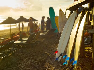 Bali surfers rental of surfboards Surfboards for rent on Bali beach at sunset